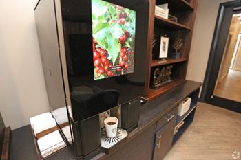 the living room has a tv and a cup of coffee